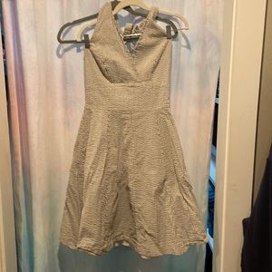 Short, white striped low V-neck dress with tie back